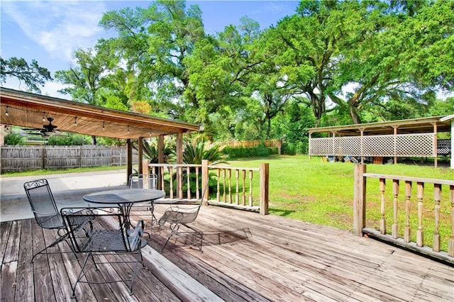 1215 Anchor Dr, Mobile, AL 36693 - deck featuring a ceiling fan and outdoor dining space