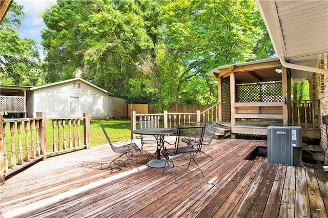1215 Anchor Dr, Mobile, AL 36693 - wooden deck with central air condition unit and outdoor dining space