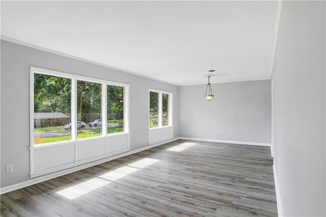 1215 Anchor Dr, Mobile, AL 36693 - spare room with baseboards, wood finished floors, and ornamental molding