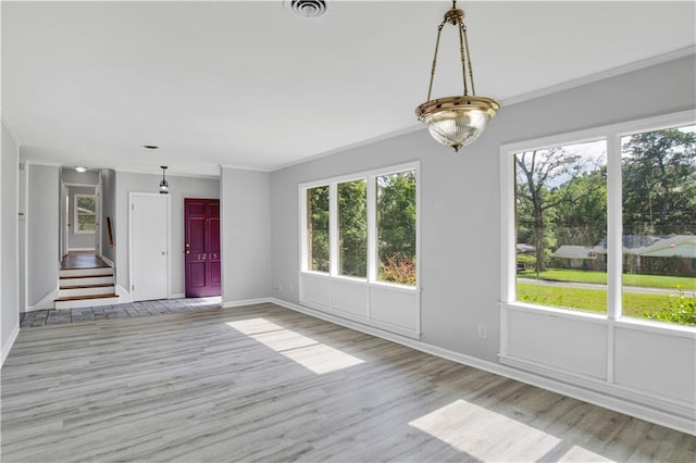 1215 Anchor Dr, Mobile, AL 36693 - unfurnished living room with plenty of natural light, baseboards, and ornamental molding