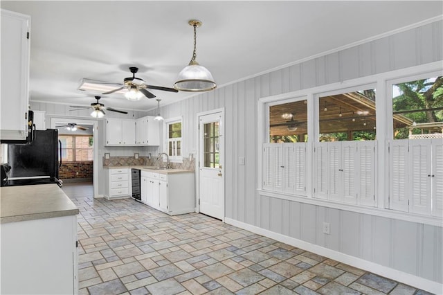 1215 Anchor Dr, Mobile, AL 36693 - kitchen with a sink, white cabinetry, ceiling fan, light countertops, and wine cooler