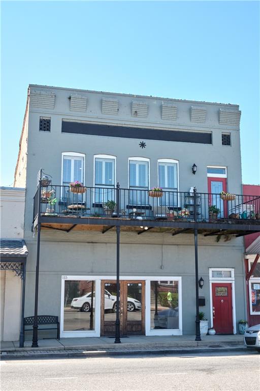 back of property featuring a balcony