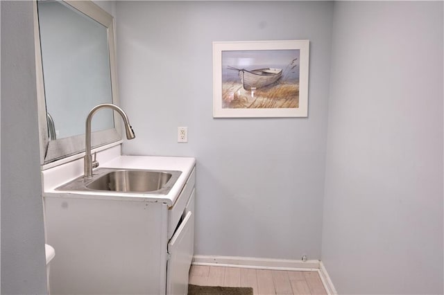 interior space featuring light hardwood / wood-style flooring and sink