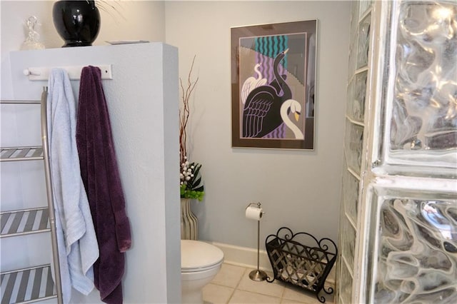 bathroom with tile floors and toilet