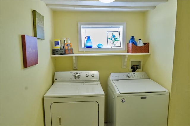 clothes washing area with separate washer and dryer and hookup for a washing machine