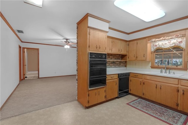 kitchen featuring sink, ornamental molding, ceiling fan, light colored carpet, and black dishwasher