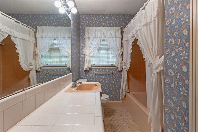 full bathroom featuring vanity, tile patterned flooring, toilet, and shower / tub combo