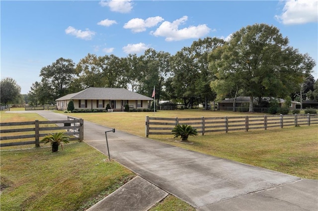 exterior space with a front yard and a rural view