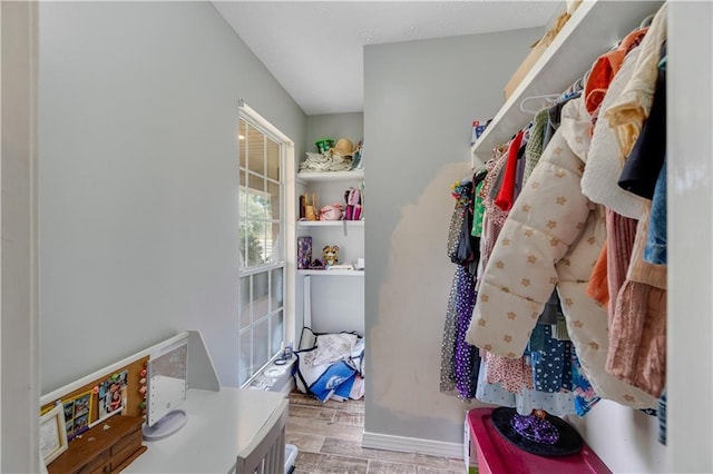 walk in closet featuring light hardwood / wood-style floors