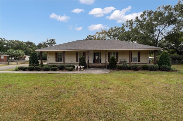 single story home with a porch and a front yard