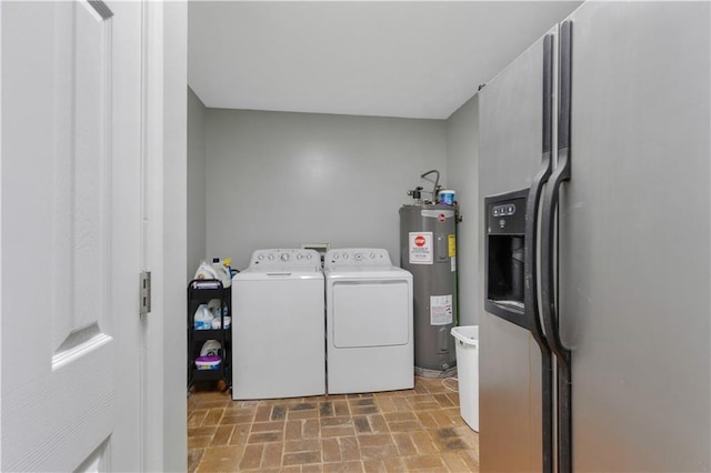 washroom featuring independent washer and dryer and water heater