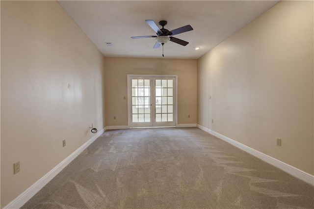 carpeted empty room with ceiling fan