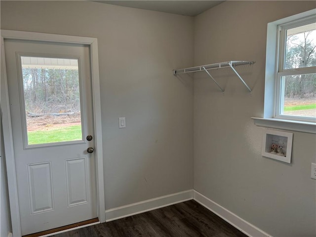 laundry area featuring washer hookup, dark hardwood / wood-style flooring, and a healthy amount of sunlight