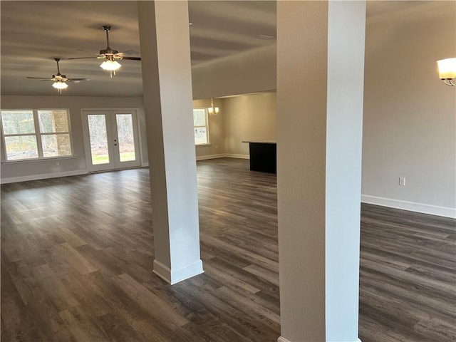 unfurnished room with ceiling fan, dark hardwood / wood-style floors, and vaulted ceiling