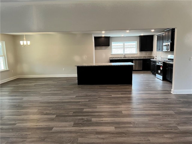 interior space featuring dark hardwood / wood-style floors, a chandelier, and sink