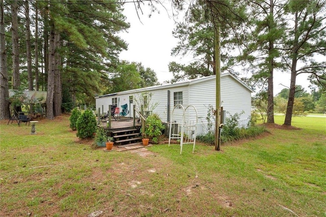 23700 Cumberland Rd, Robertsdale, AL 36567 - back of house featuring a deck and a lawn