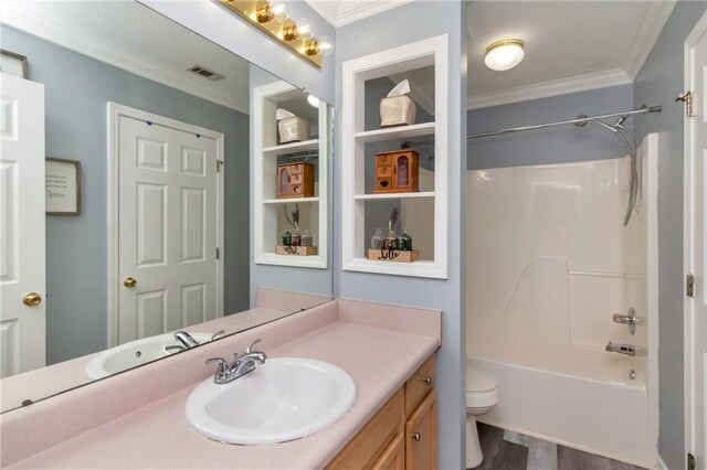 8522 Brandy Oak Ct, Mobile, AL 36695 - bathroom featuring vanity, crown molding, wood finished floors, toilet, and shower / bathtub combination