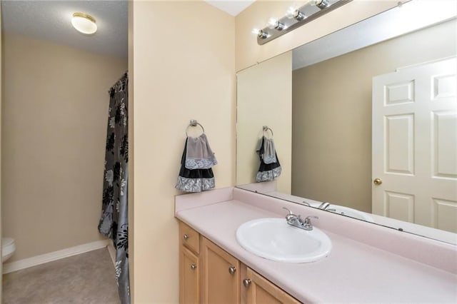 8522 Brandy Oak Ct, Mobile, AL 36695 - full bathroom with vanity, toilet, a shower with shower curtain, and baseboards