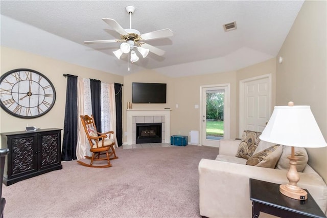 8522 Brandy Oak Ct, Mobile, AL 36695 - living area with carpet floors, ceiling fan, lofted ceiling, and a tile fireplace
