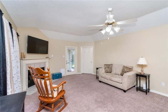 8522 Brandy Oak Ct, Mobile, AL 36695 - living room with a fireplace, light colored carpet, ceiling fan, baseboards, and a textured ceiling