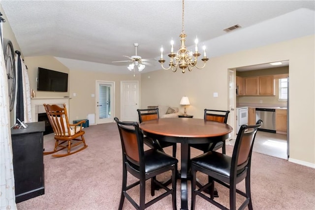 8522 Brandy Oak Ct, Mobile, AL 36695 - dining room featuring light colored carpet, vaulted ceiling, a chandelier, ceiling fan, and a textured ceiling