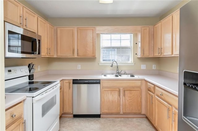 8522 Brandy Oak Ct, Mobile, AL 36695 - kitchen with stainless steel appliances, a sink, light brown cabinets, and light countertops