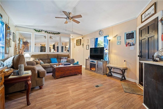 living room featuring lofted ceiling, light wood-type flooring, and ceiling fan