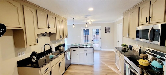 kitchen with kitchen peninsula, crown molding, pendant lighting, french doors, and stainless steel appliances