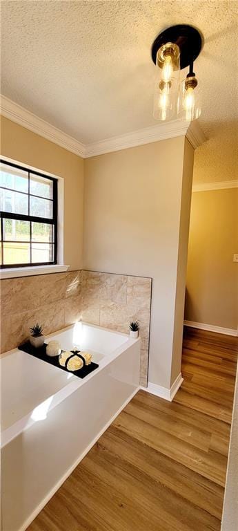 7041 Tierra W, Eight Mile, AL 36613 - kitchen with crown molding, a textured ceiling, and wood finished floors
