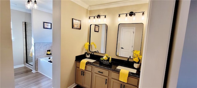 bathroom featuring vanity, independent shower and bath, ornamental molding, and hardwood / wood-style floors