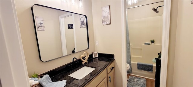 full bathroom with vanity, shower / bath combo, and toilet