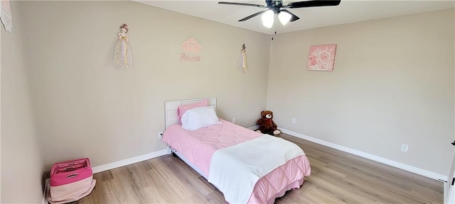 bedroom featuring ceiling fan and hardwood / wood-style floors