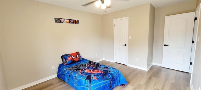 bedroom featuring ceiling fan and hardwood / wood-style flooring