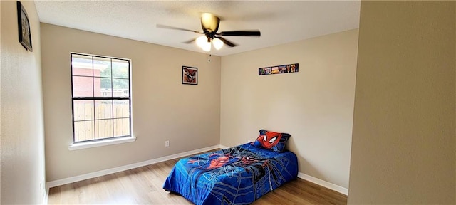 bedroom featuring wood-type flooring and ceiling fan