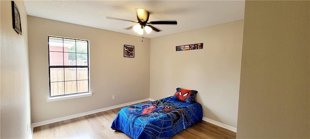 7041 Tierra W, Eight Mile, AL 36613 - bedroom featuring wood finished floors and ceiling fan