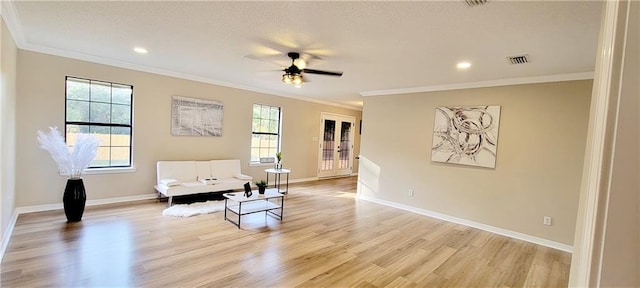 7041 Tierra W, Eight Mile, AL 36613 - living area with crown molding, plenty of natural light, light wood-type flooring, ceiling fan, and recessed lighting