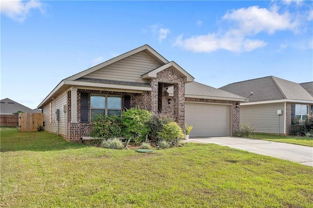 view of front of property featuring a garage and a front yard