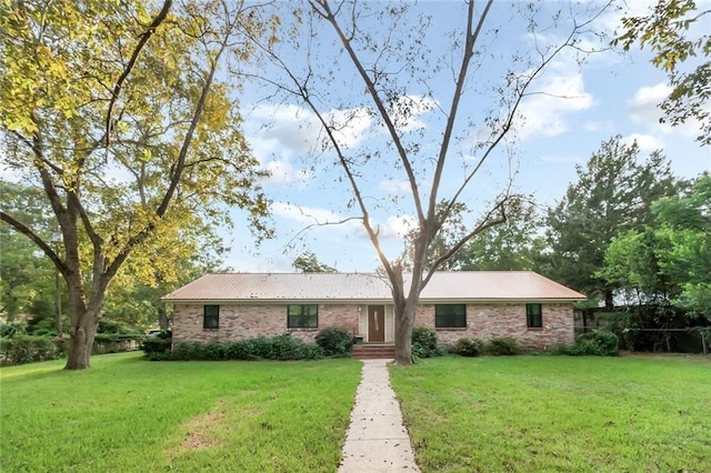 ranch-style house with a front lawn