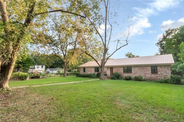 ranch-style house with a front lawn