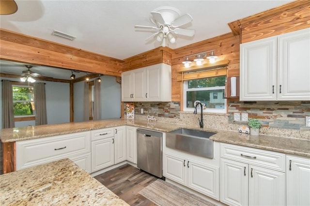 kitchen featuring dishwasher, white cabinets, and ceiling fan