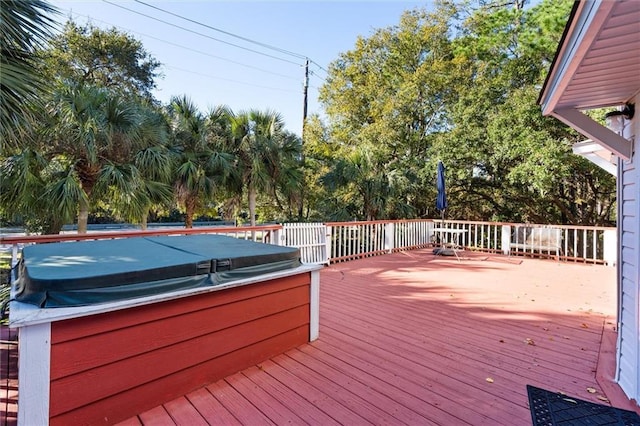 deck with a hot tub