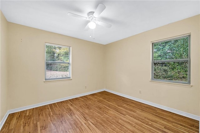 unfurnished room featuring hardwood / wood-style flooring and ceiling fan