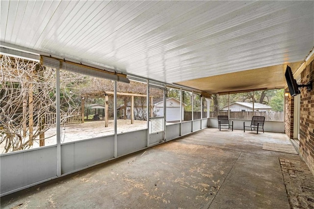 unfurnished sunroom with a healthy amount of sunlight