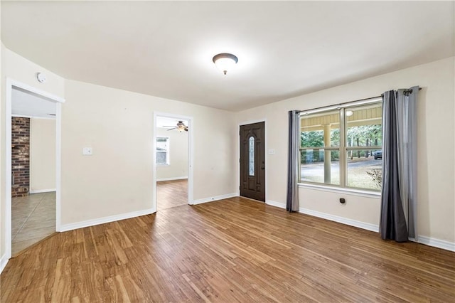 interior space featuring hardwood / wood-style flooring and ceiling fan