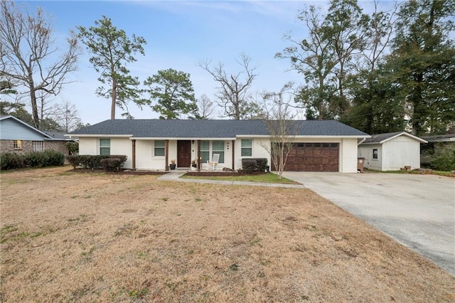 ranch-style house with a garage and a front yard