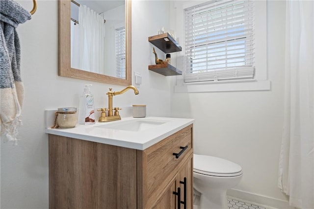 bathroom with vanity and toilet