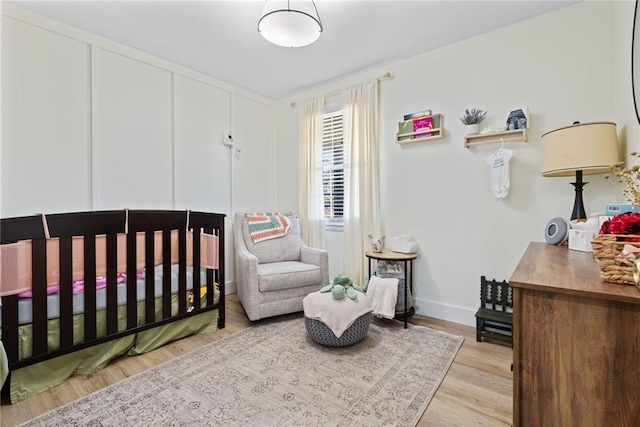 bedroom with light hardwood / wood-style floors