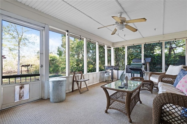 sunroom with a wealth of natural light and ceiling fan