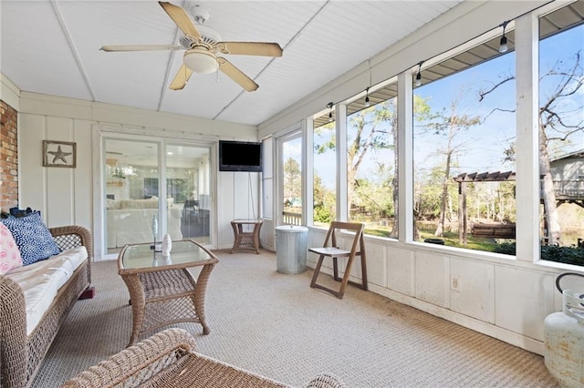 sunroom / solarium with ceiling fan