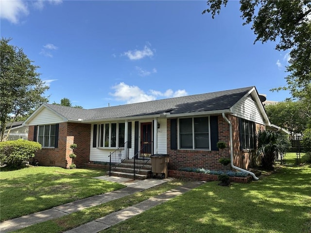 2911 Thornhill Dr, Mobile, AL 36606 - ranch-style house featuring brick siding, a front lawn, and a shingled roof
